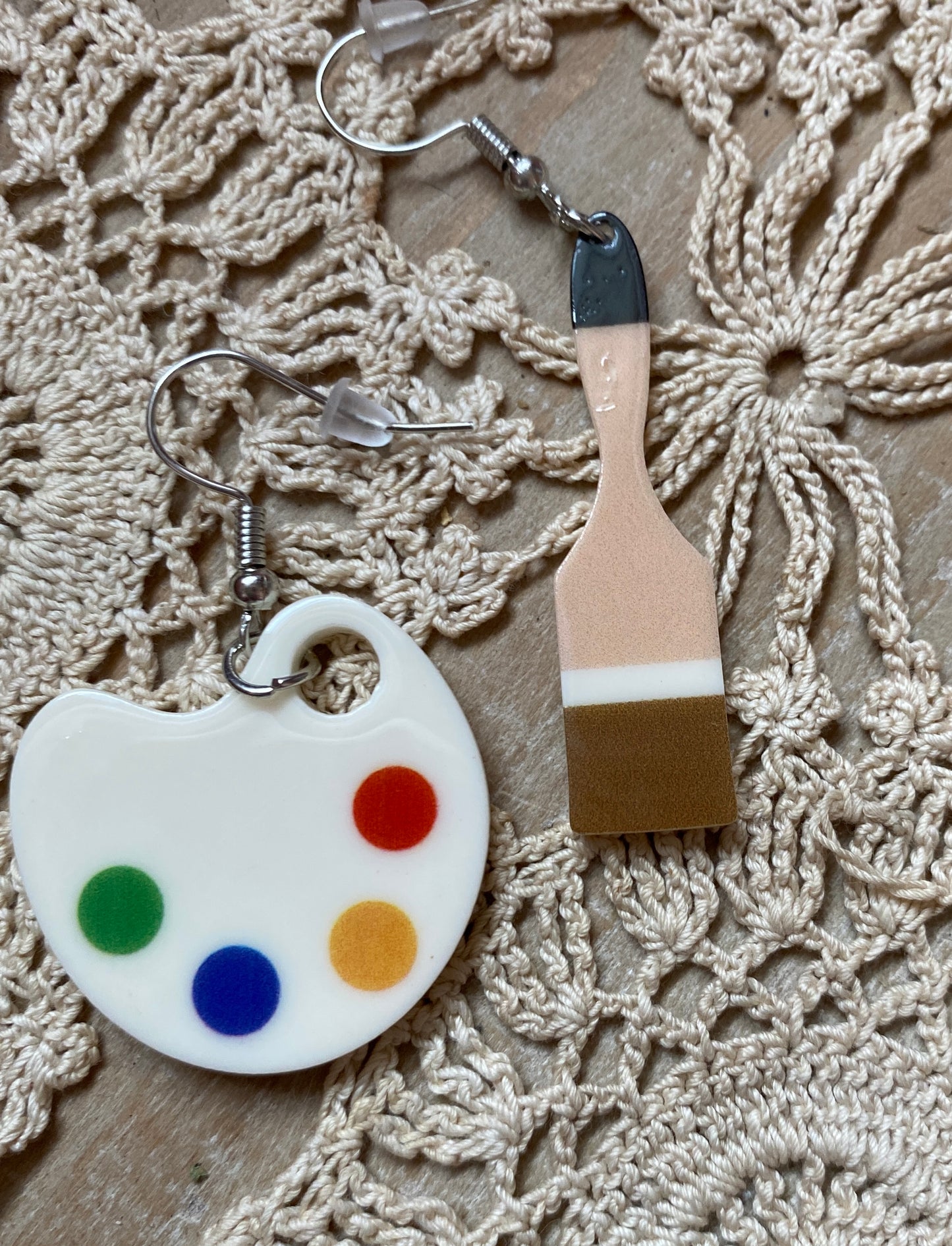Acrylic earrings design on one side palette and paint brush