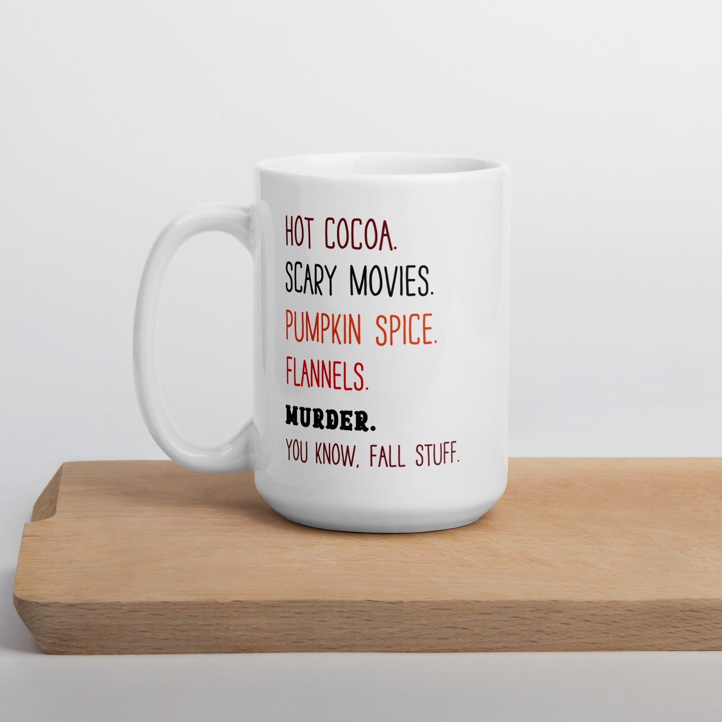 Hot cocoa, scary movies, pumpkin spice, flannels, murder, you know fall stuff fun ceramic mug