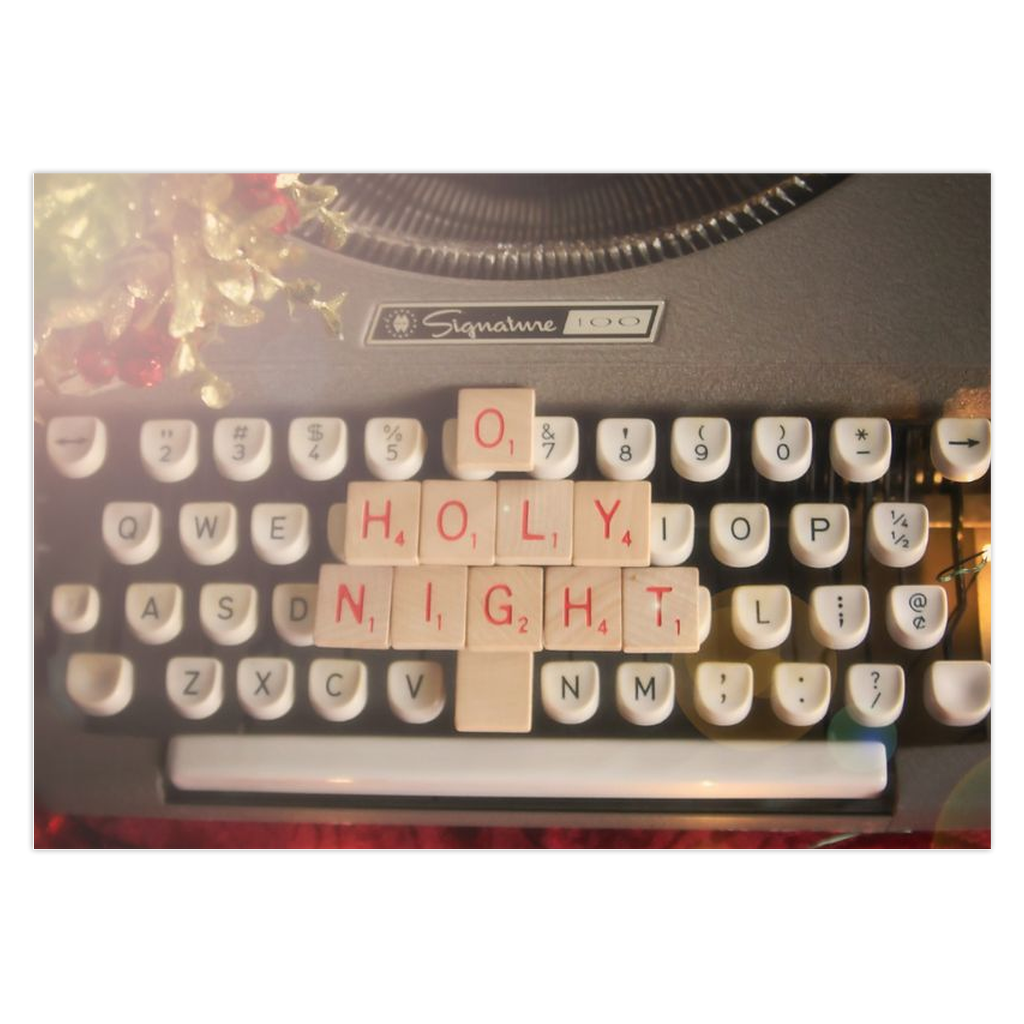 Game tiles on a vintage typewriter O Holy Night