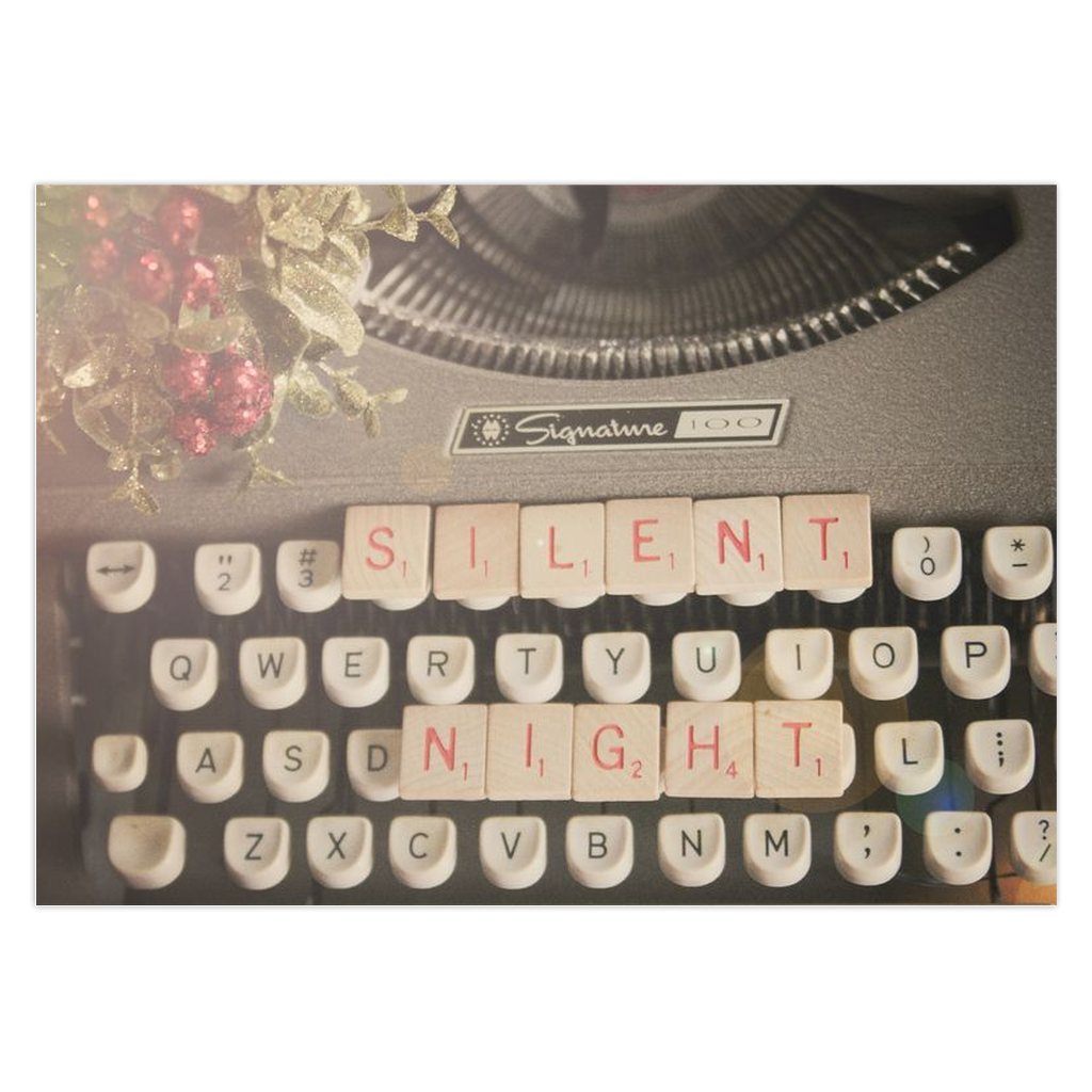 Game tiles on a vintage typewriter Silent Night