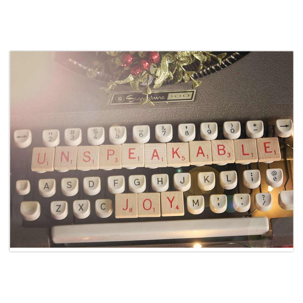 Game tiles on a vintage typewriter Unspeakable joy